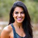 Portrait of Maya Singh, Cultural Experience Coordinator, smiling warmly.